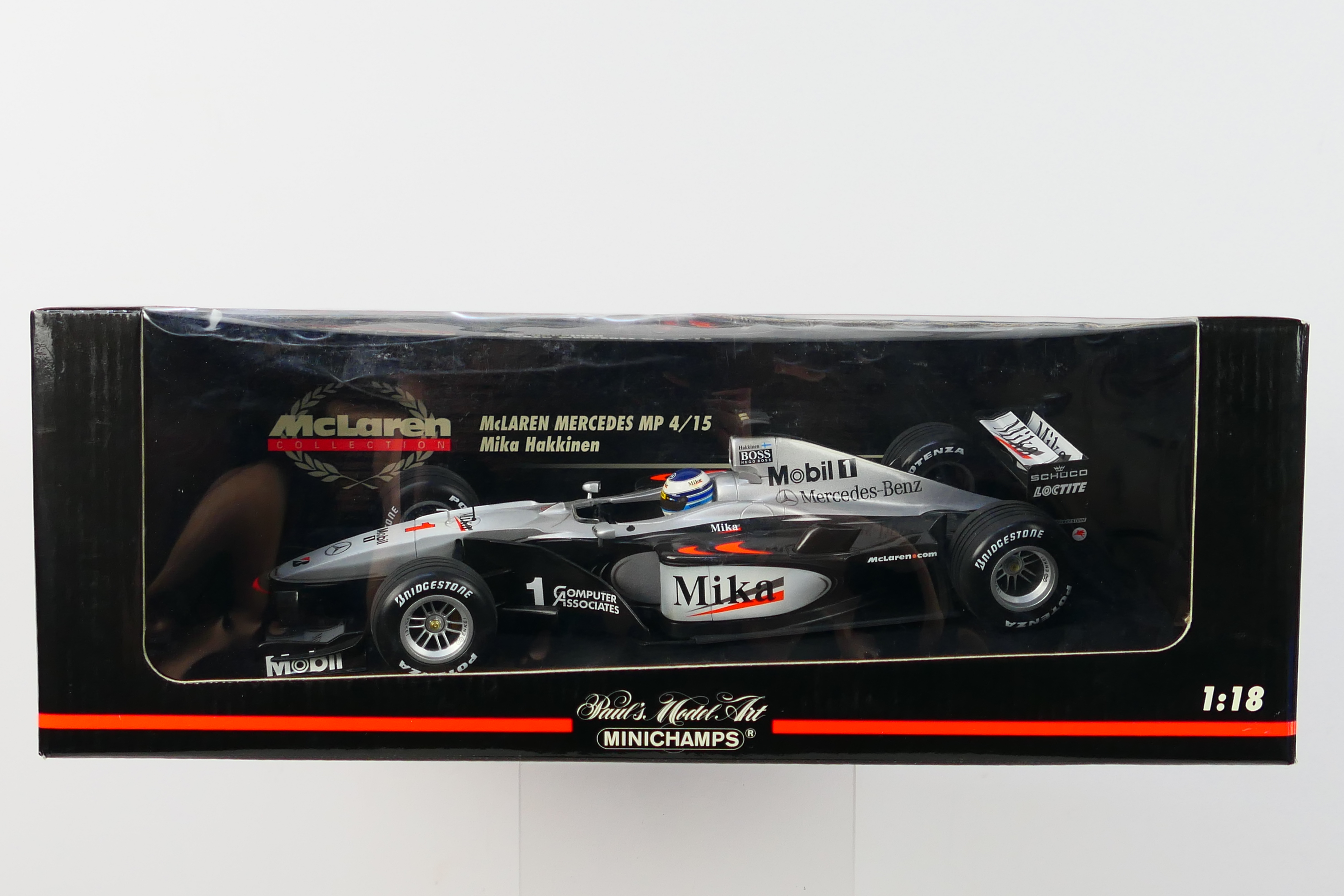 Minichamps- A boxed 1:18 scale McLaren Mercedes MP4/15 Mikka Hakkinen car which appears Mint in a