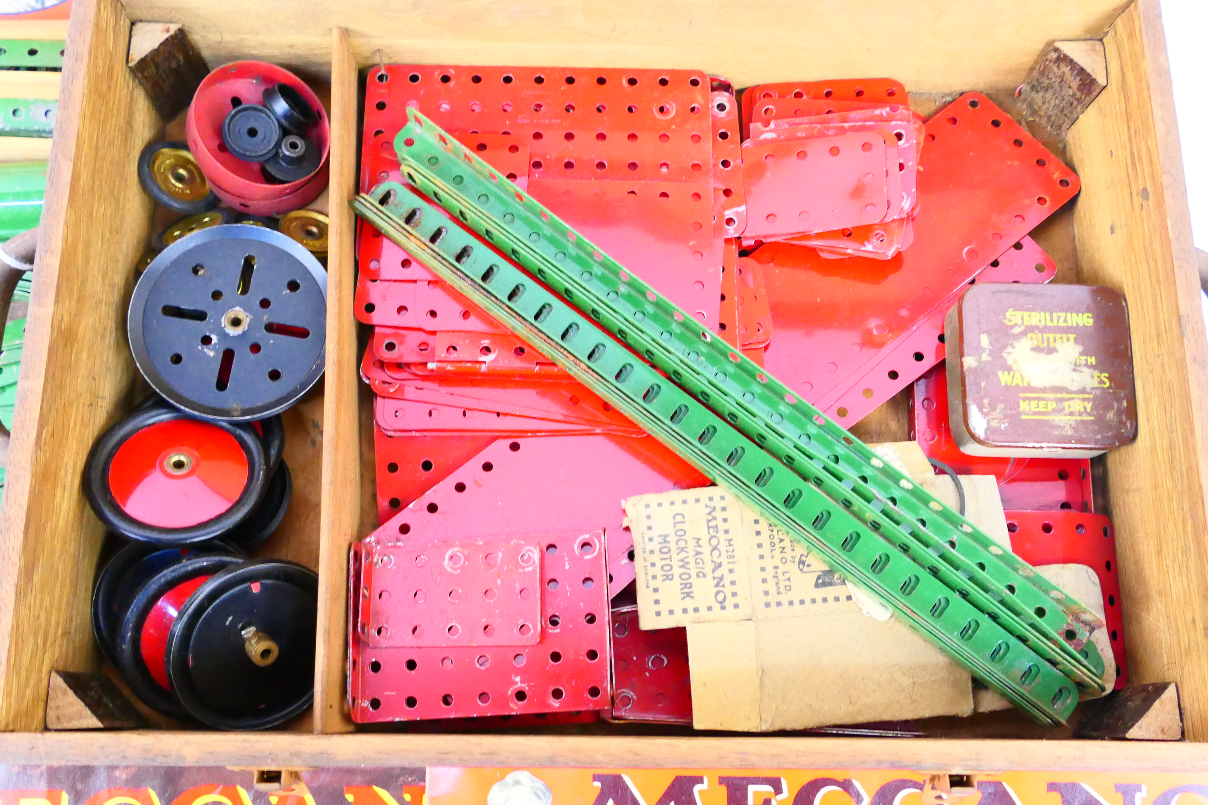 Meccano - A vintage wooden boxed Meccano set containing a quantity of red and green parts, wheels, - Image 3 of 8
