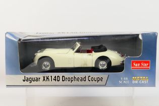 Sun Star - A boxed Sun Star #2803 1:18 scale Jaguar XK140 Drophead Coupe.