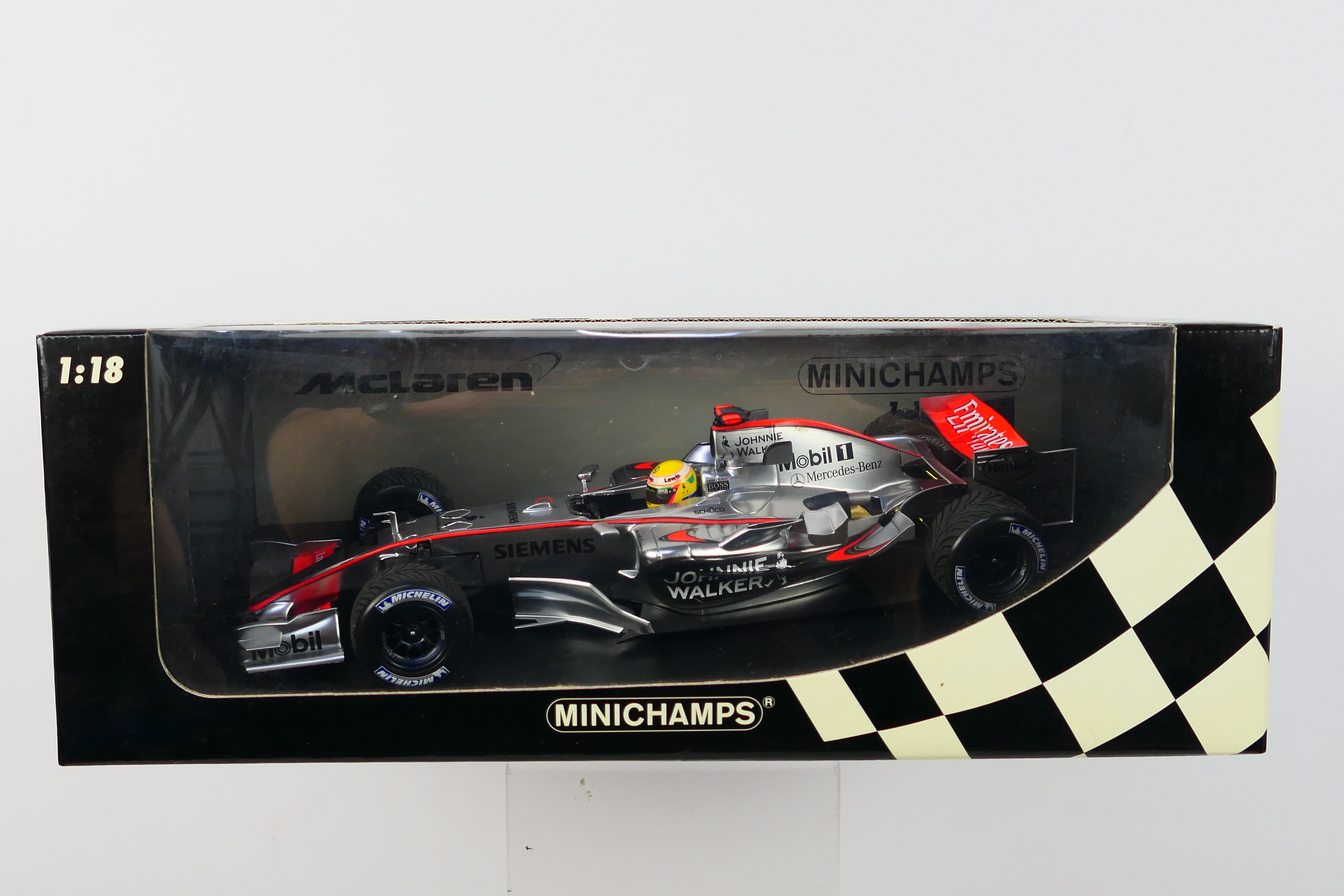 Minichamps - A boxed limited edition 1:18 scale McLaren Mercedes MP4-21 Lewis Hamilton 1st roll out