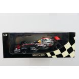 Minichamps - A boxed limited edition 1:18 scale McLaren Mercedes MP4-21 Lewis Hamilton 1st roll out