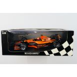 Minichamps- A boxed 1:18 scale Orange Arrows Asiatech A22 Enrique Bernoldi car which appears Mint