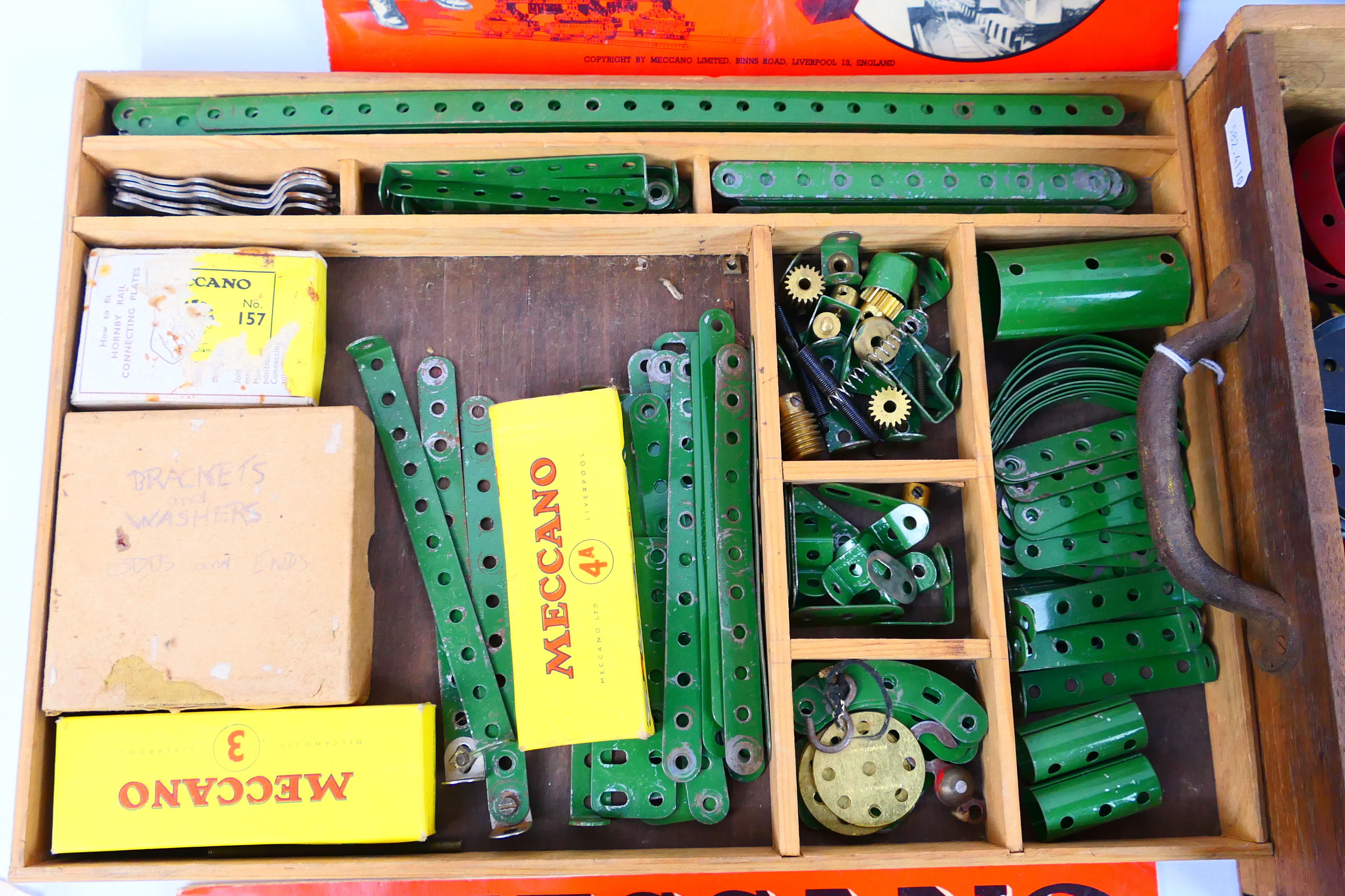 Meccano - A vintage wooden boxed Meccano set containing a quantity of red and green parts, wheels, - Image 2 of 8