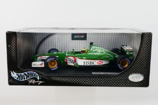 Hot Wheels - A boxed 1:18 scale Jaguar R2 Pedro De La Rosa car which appears Mint in a Good box