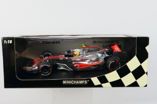 Minichamps - A boxed limited edition 1:18 scale McLaren Mercedes MP4-22 Lewis Hamilton 1st win