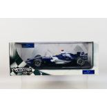 Hot Wheels - A boxed 1:18 scale Williams FW28 Mark Webber 2006 F1 car # 27084312041.