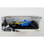 Hot Wheels - A boxed 1:18 scale Renault R24 Fernando Alonso car which appears Mint in a Good box