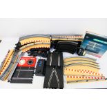 Scalextric - A quantity of slot car track sections, track side barriers, a boxed lap counter timer,