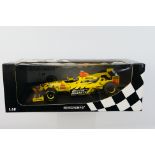 Minichamps- A boxed 1:18 scale Jordan Mugen Honda Damon Hill car which appears Mint in a Good box