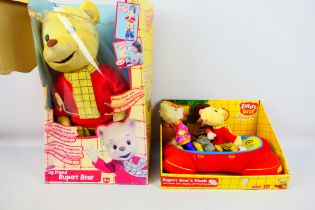 Born to Play - Two boxed Rupert the Bear themed soft toys.