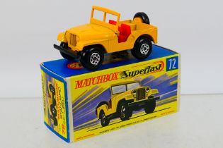 Matchbox - Superfast - A boxed Standard Jeep in yellow with dark red axle clips # 72 which appears