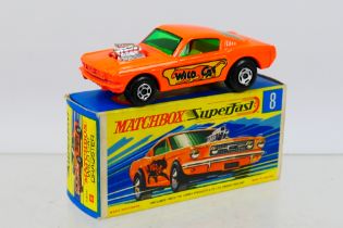 Matchbox - Superfast - A boxed Ford Mustang Wild Cat Dragster in orange with black base # 8.