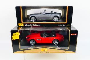 Maisto - 2 x boxed 1:18 scale BMW models,