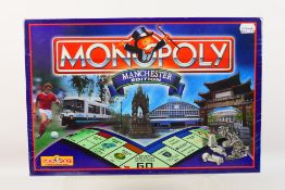 Hasbro - Monopoly - An unopened Manchester Edition Monopoly set 1998 issue.