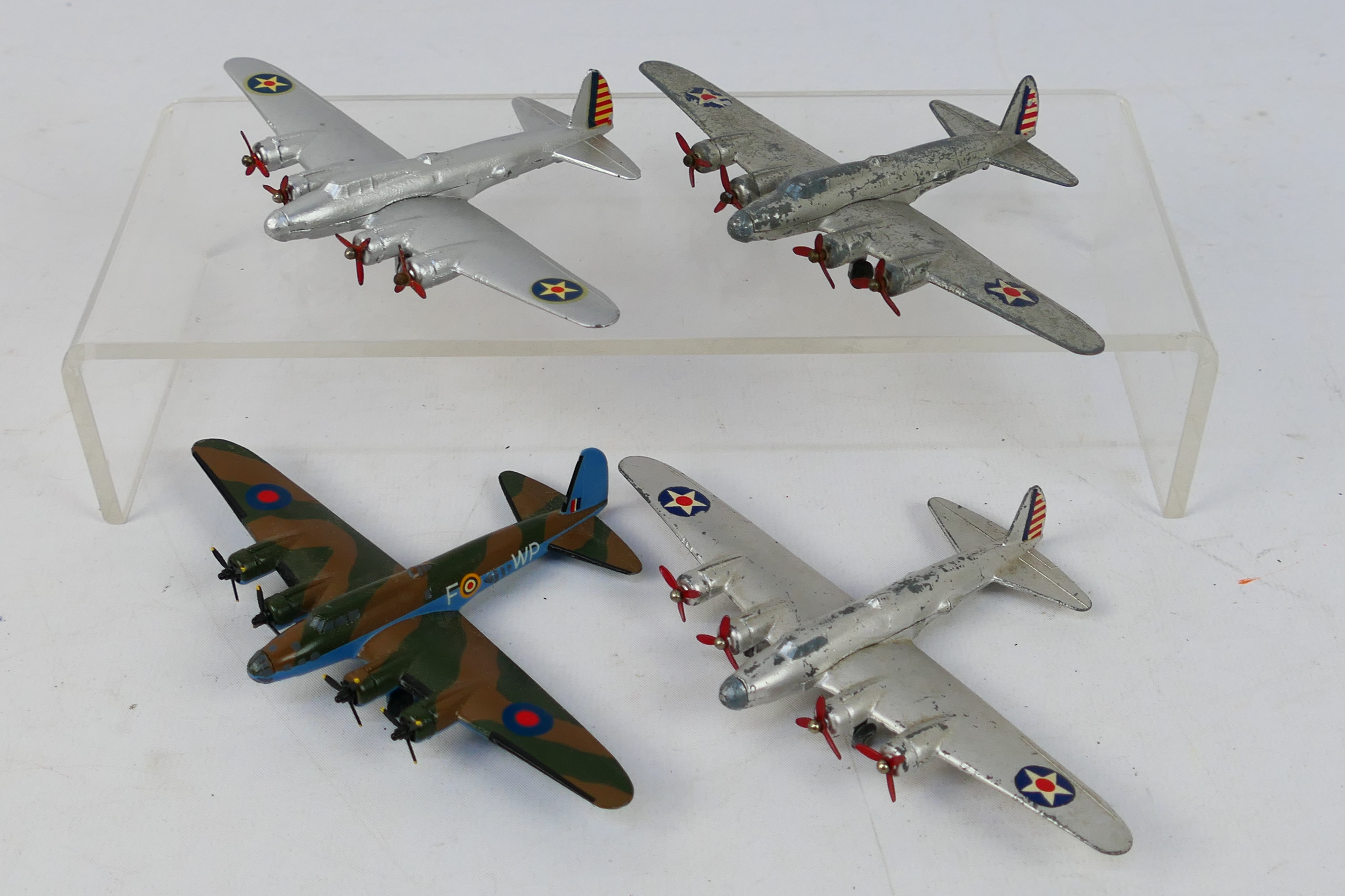 Dinky Toys - An unboxed group of four pre-war Dinky Toys 62g Long Range Bomber - three of the