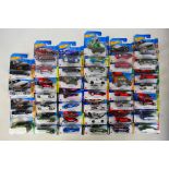 Hot Wheels - 40 factory sealed blister packed vehicles to include Dragon' wagon (HKG26-M521),