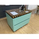 Green mobile island unit with chequered timber worktop