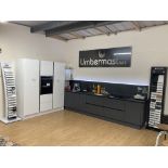 Charcoal and white display kitchen with appliances