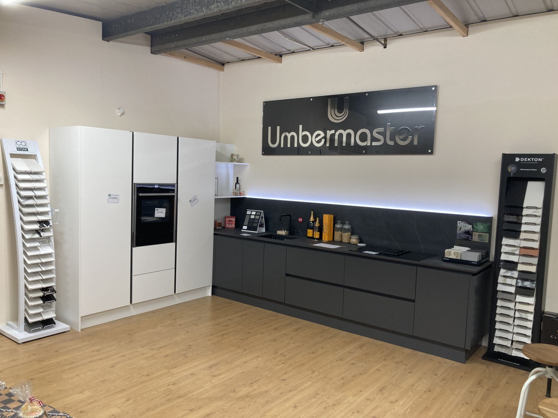 Charcoal and white display kitchen with appliances