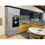 Yellow and grey unfinished display kitchen with appliance