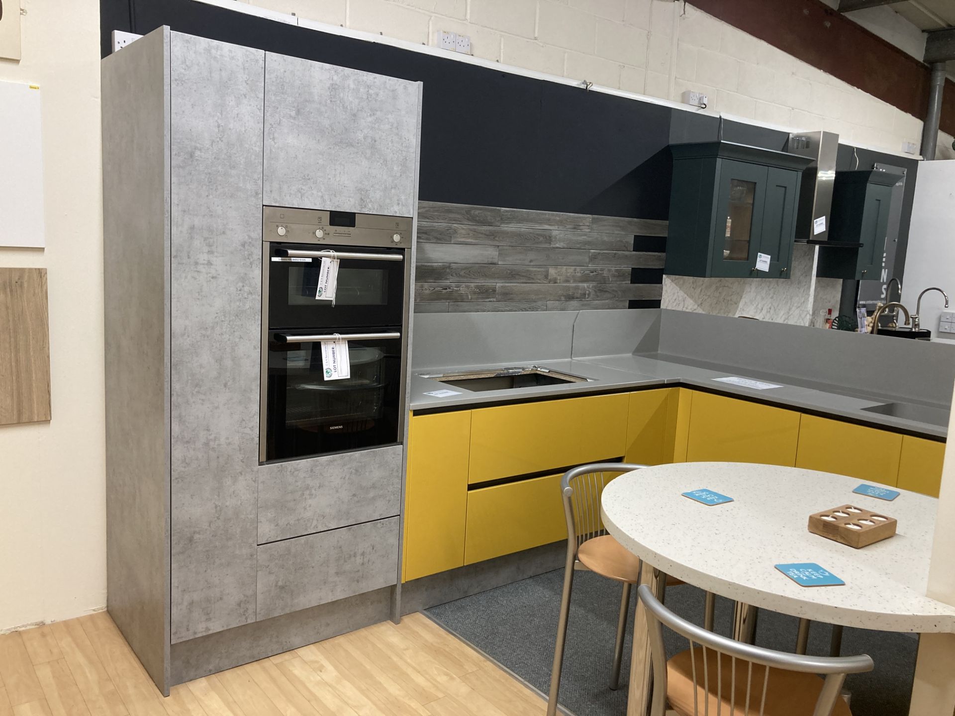 Yellow and grey unfinished display kitchen with appliance