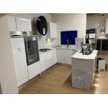 White handleless kitchen display with appliances