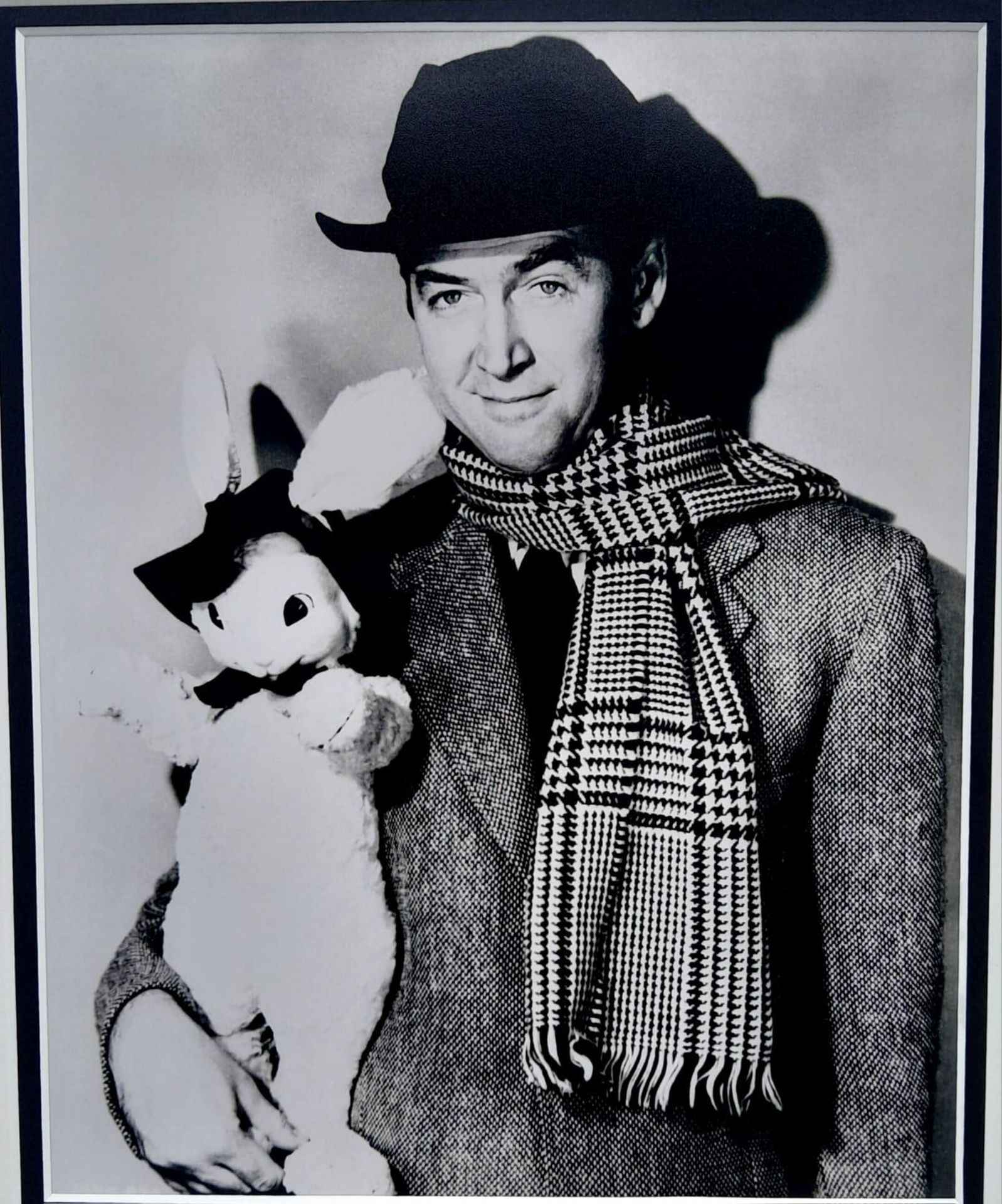 A PHOTO OF JIMMY STEWART AND THE FAMOUS WHITE RABBIT "HARVEY" WITH A SIGNED CHEQUE FROM HIS PERSONAL - Image 2 of 4