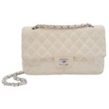 A Chanel Quilted White Lambskin Shoulder Flap Bag. White perforated quilted caviar leather