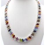 A dazzling Marquise Cut Gemstone Tennis Necklace set in 925 Silver. Featuring a wide variety of