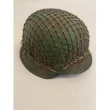 A Rare German WW2 M42 Camo Helmet with Strapping. The chin strap and liner are intact. ML596