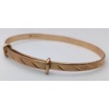 A Vintage 9K Yellow Gold Expandable Baby's Bangle. 2.86g weight.
