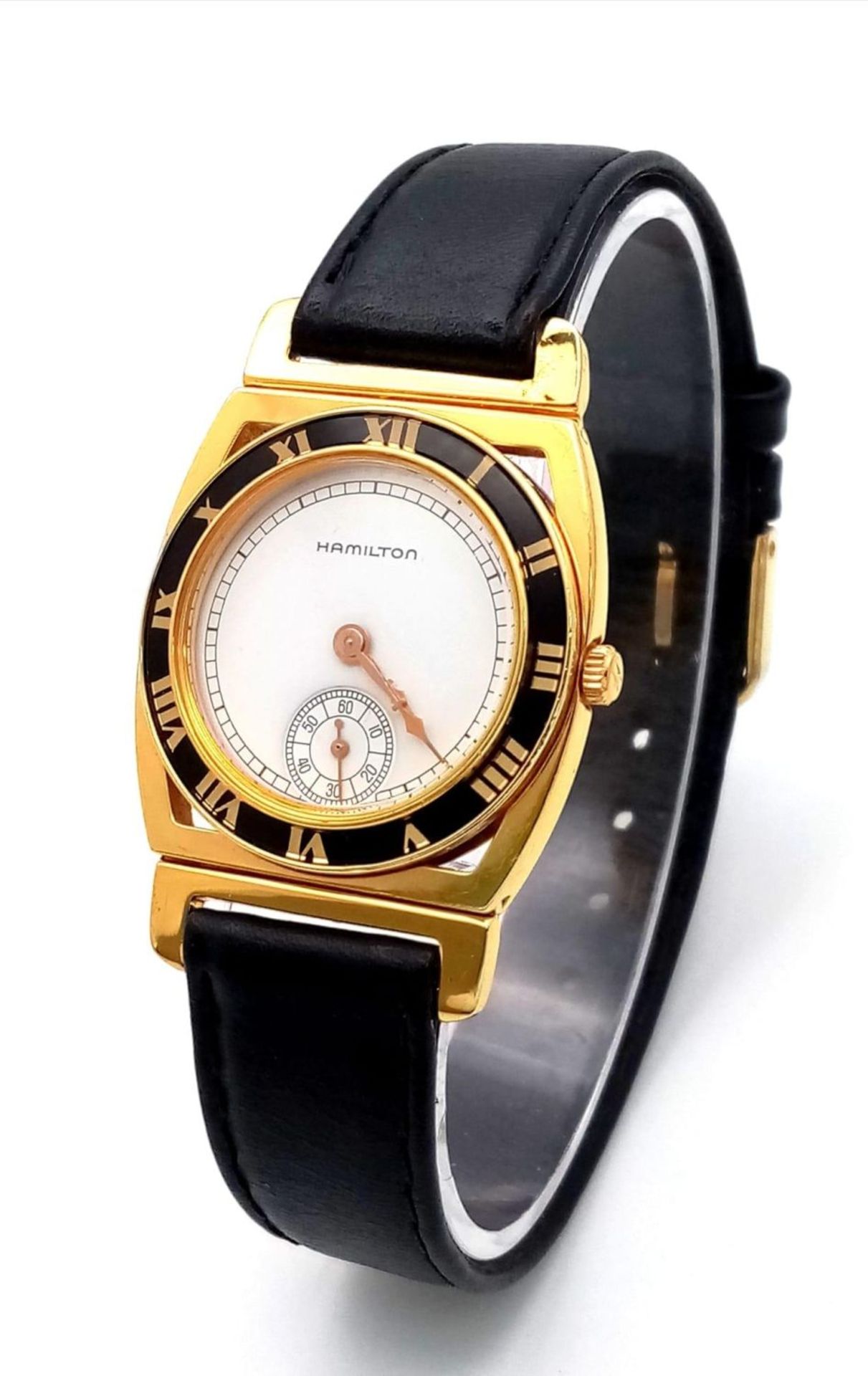 A Menâ€™s 1980â€™s Hamilton Piping Rock, 18 Carat Gold Electroplated, Second Dial Quartz Watch Being