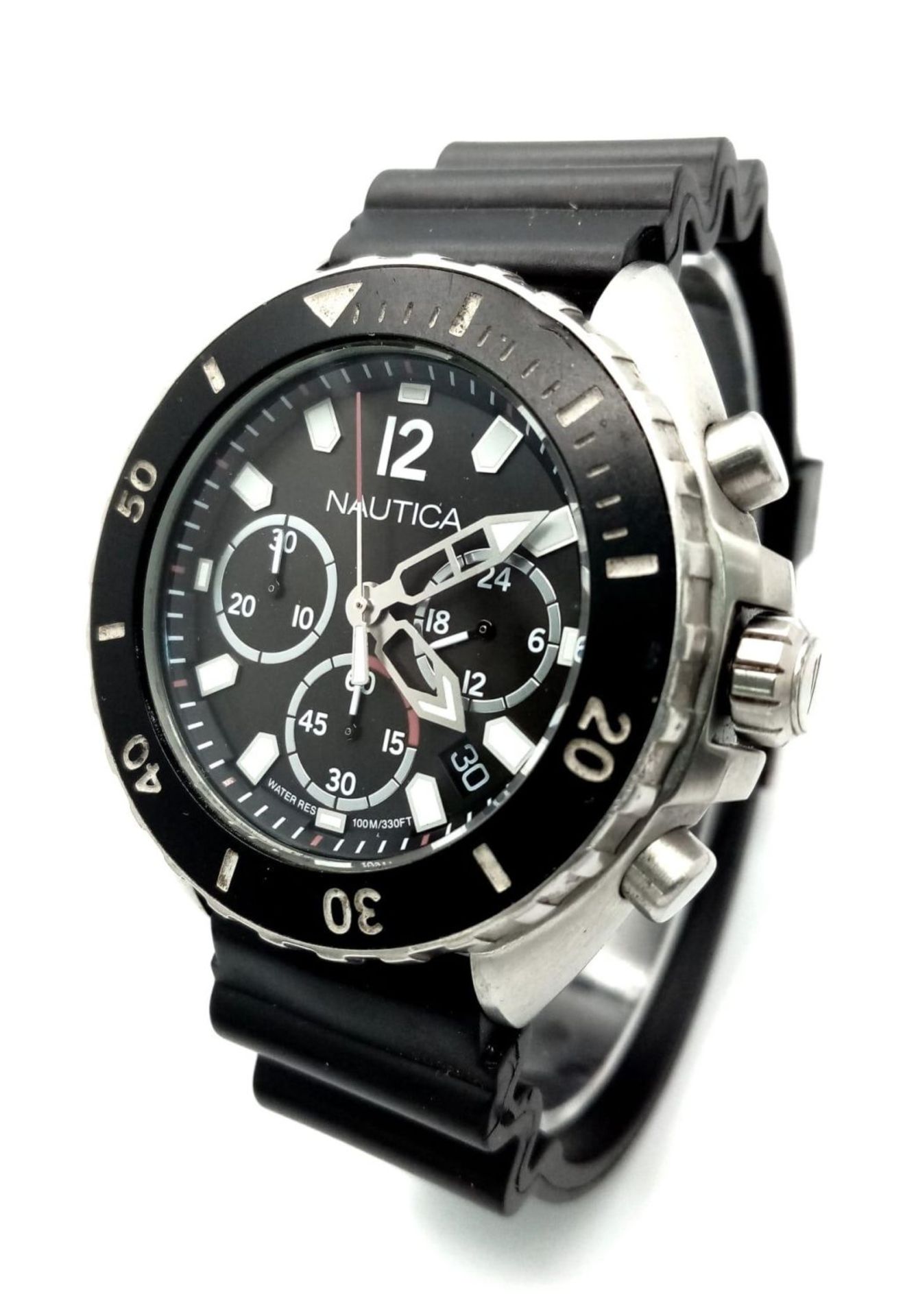 A Nautica Chronograph Quartz Gents Watch. Black rubber strap . Stainless steel case - 46mm. Black