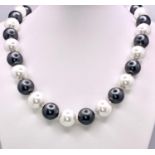 An Attractive Silver and White South Sea Pearl Shell Bead Necklace - 14mm large beads. Necklace