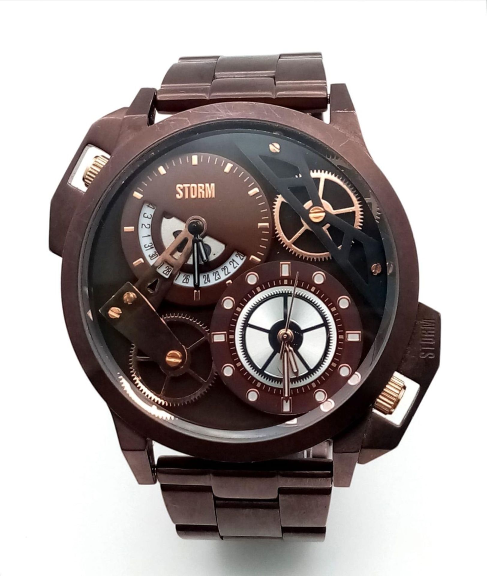 An Ex Display, Menâ€™s Dual Time Bronze Tone Quartz Watch by Storm. Replacement Batteries Fitted