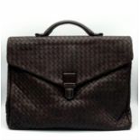 A Bottega Veneta Black Leather Briefcase. Leather intrecciato weave exterior with a large zipped