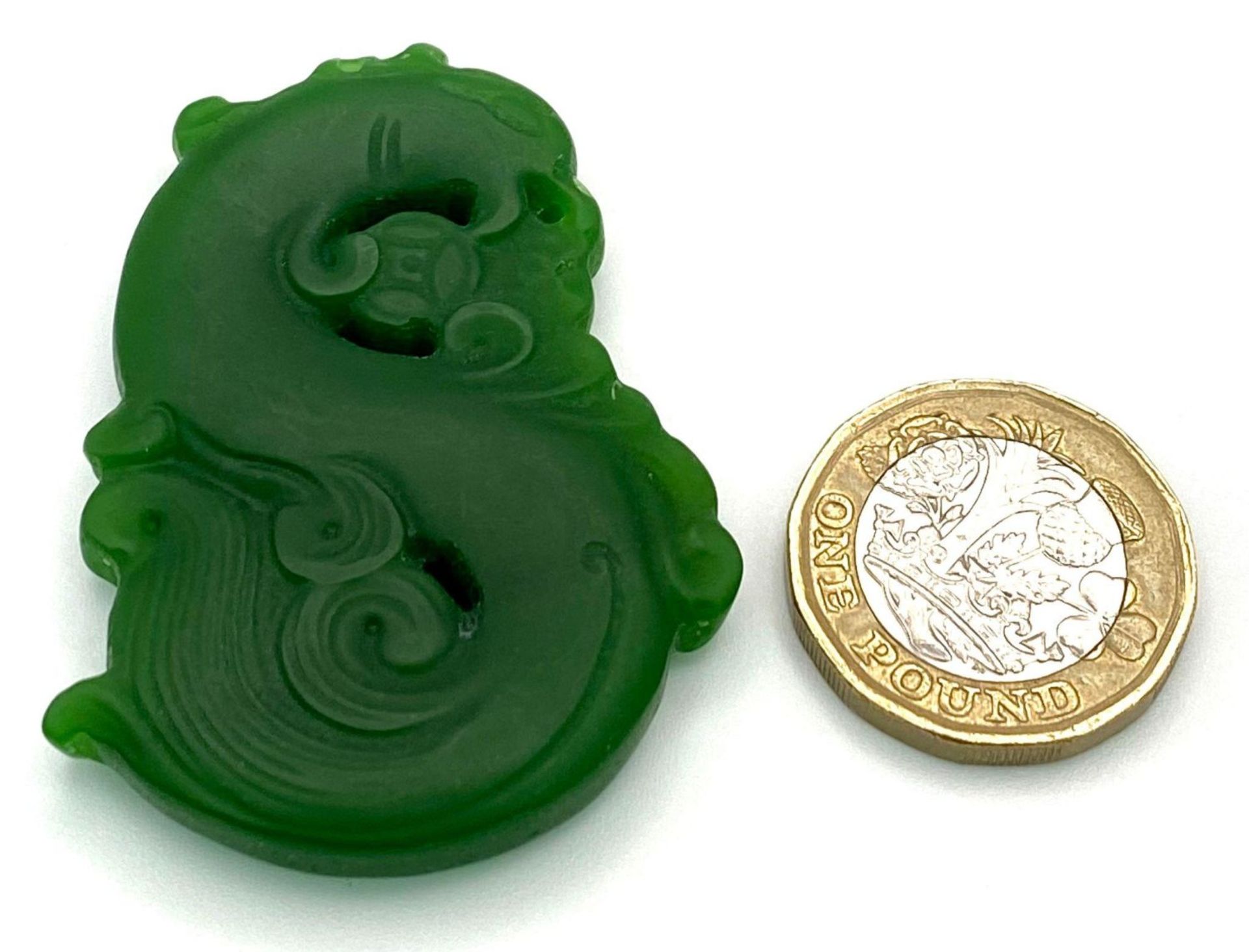 A Chinese Green Jade Swirling Dragon Pendant. 5cm - Image 3 of 3