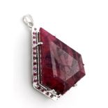 Make a massive statement! This 106.5 gram, Sterling Silver framed, 394ctw Ruby Pendant. Measures 8cm