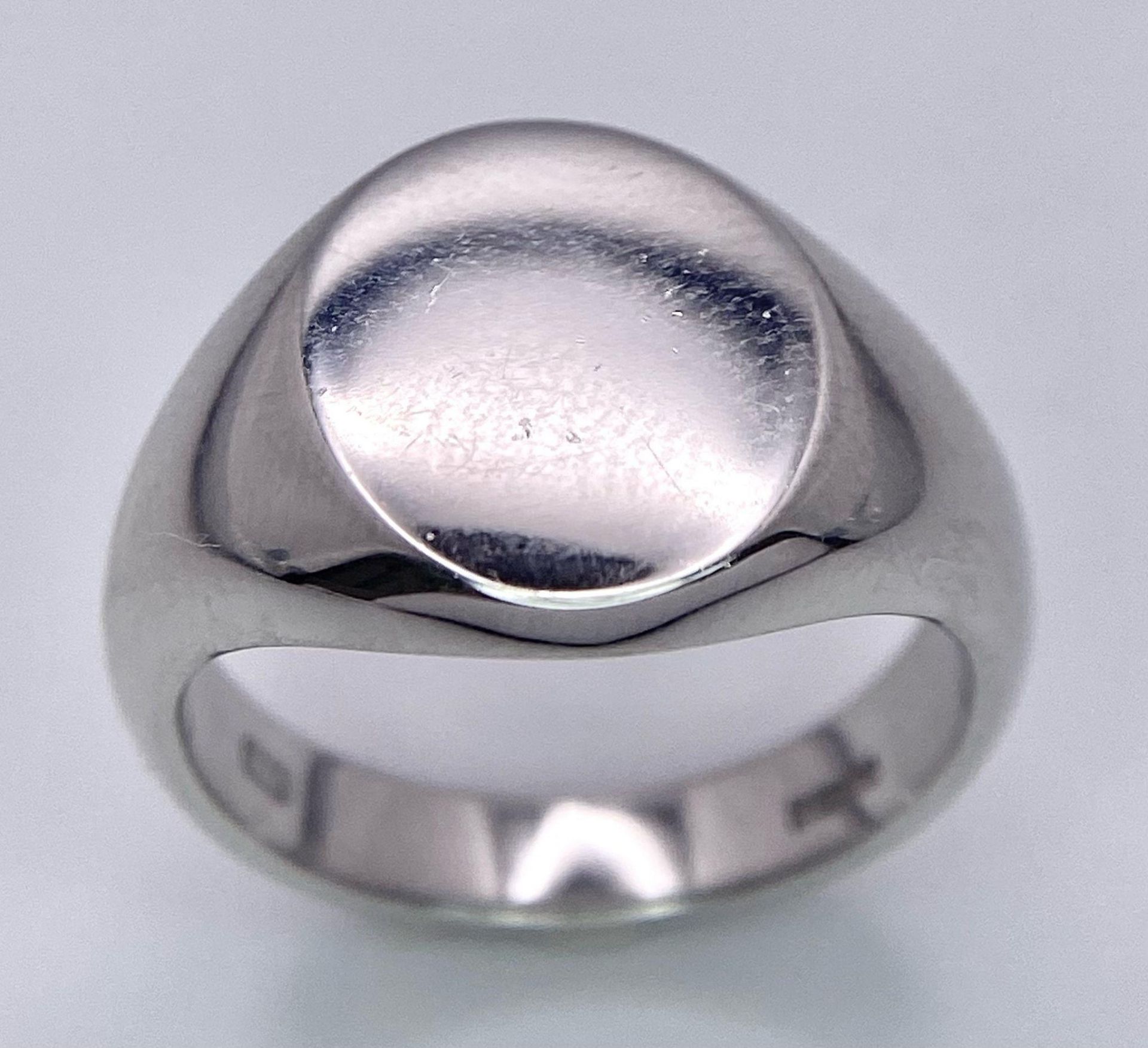 A BRAND NEW SOLID 9K WHITE GOLD SIGNET RING . 8gms size M