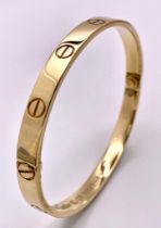 A 18K YELLOW GOLD CARTIER STYLE BANGLE 35.8G 20.2cm (7995)