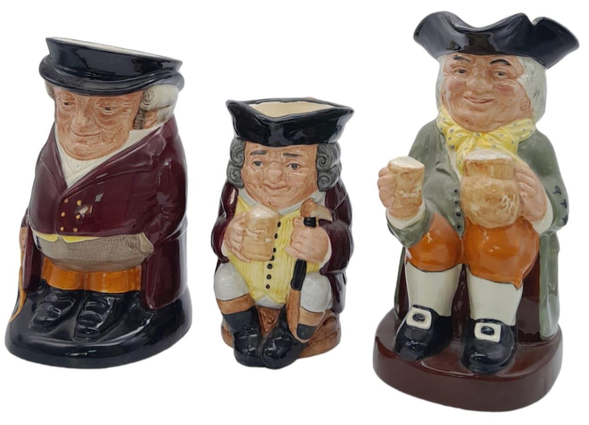 3 TRADITIONAL TOBY JUGS BY ROYAL DOULTON , JOLLY TOBY (16cms) . THE HUNTSMAN (19.5cms) AND HAPPY
