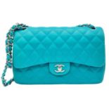 A Chanel Jumbo Double Flap Bag. Beautiful pale blue quilted caviar leather exterior. Double entwined