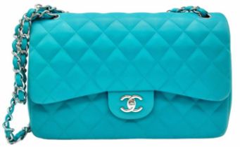 A Chanel Jumbo Double Flap Bag. Beautiful pale blue quilted caviar leather exterior. Double entwined