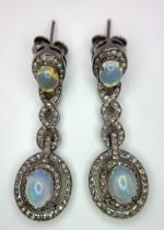 A Beautiful Pair of Opal and Diamond Drop Earrings set in 925 Silver. Diamond weight approx 2ctw.