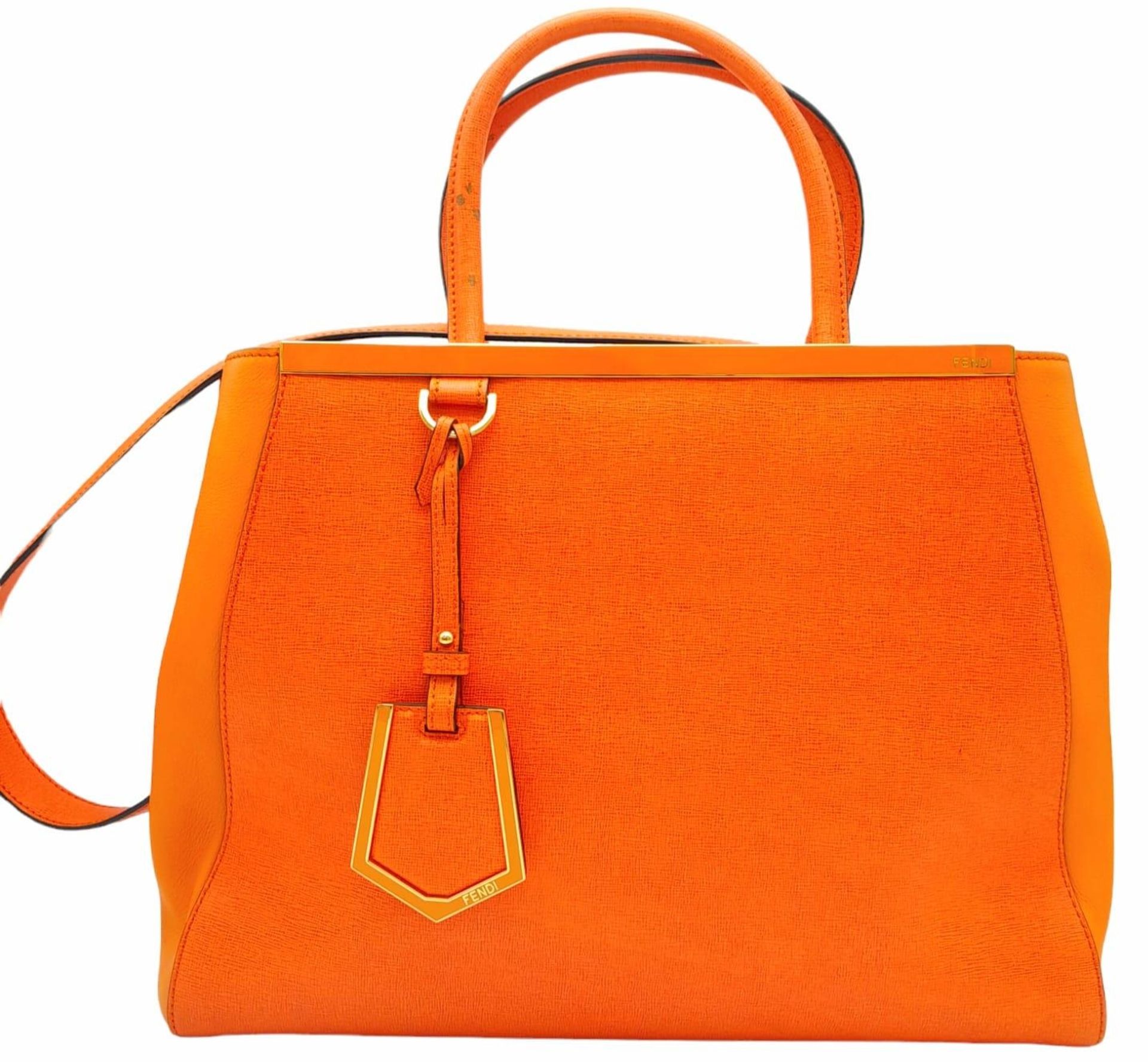 A Fendi Two Tone Orange Leather 2jours Tote Bag. Textured exterior with gold-tone hardware. Hand and