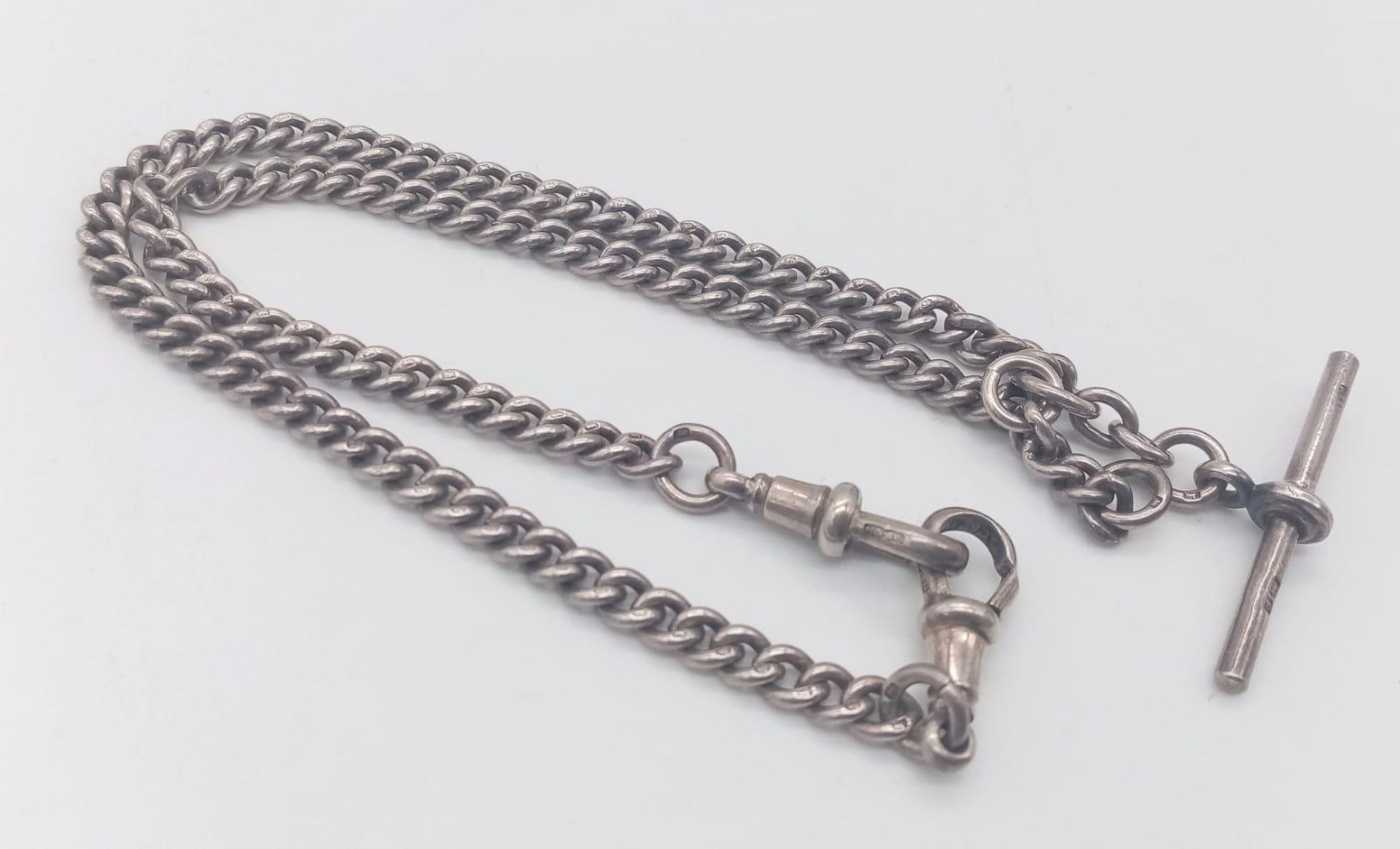 A vintage sterling silver Albert pocket watch chain with individually silver hallmark on each