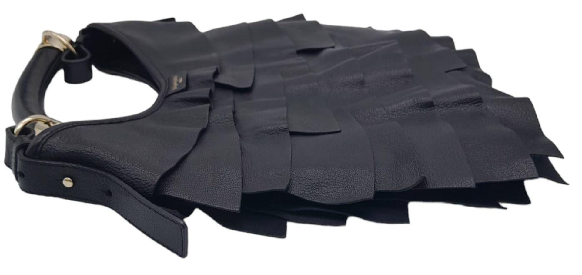 A YSL Saint-Tropez Handbag. Black leather strip exterior. Horn shaped handle. Textile interior - Image 4 of 8