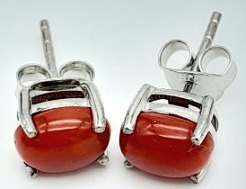 A Pair of Oval Cabochon Coral Stud Silver Earrings.