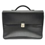 A Salvatore Ferragamo Black leather Document Bag. Textured exterior with combination lock. Textile