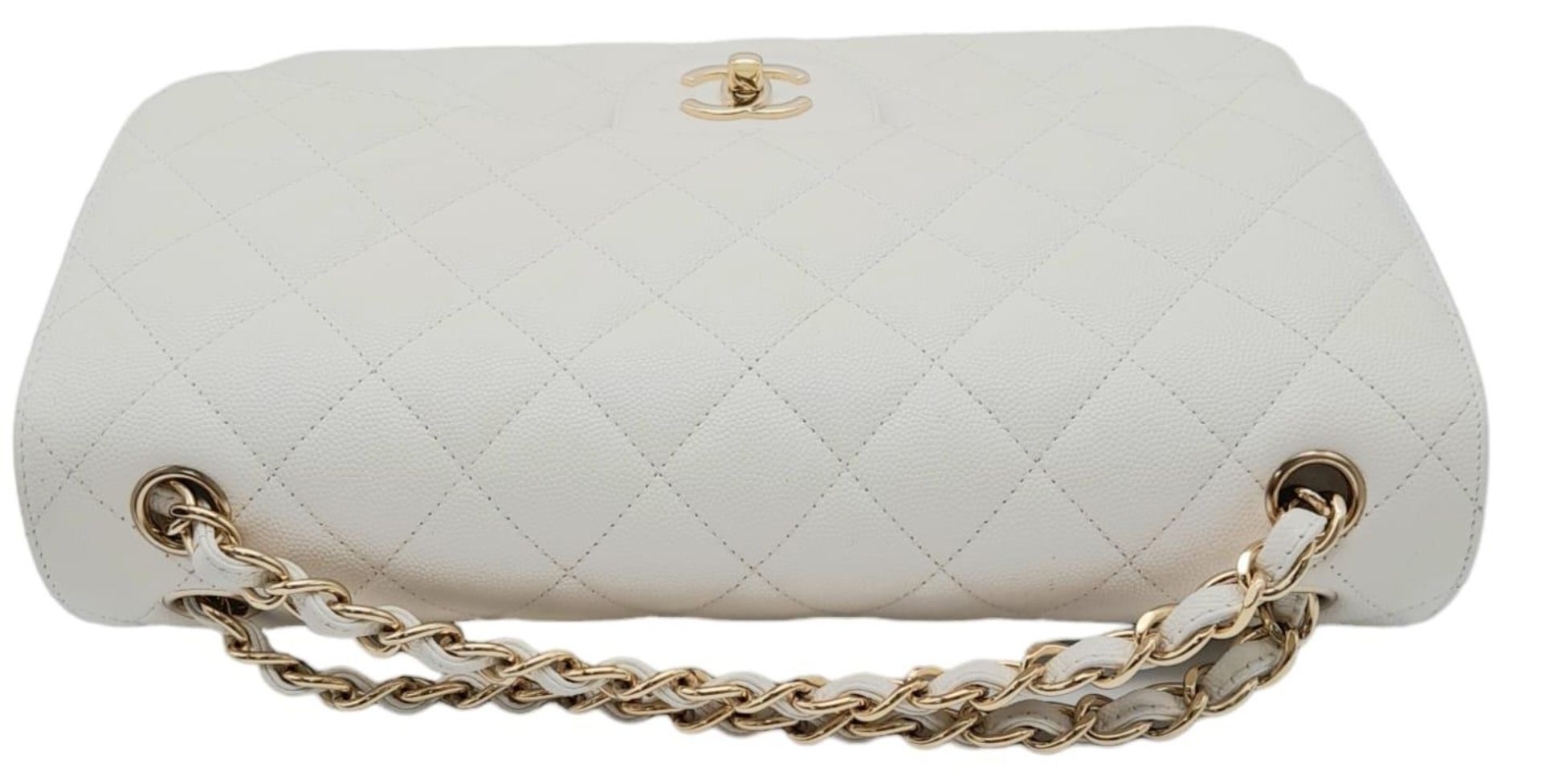 Chanel Caviar Jumbo Single Flap Bag. Quilted white caviar leather stitched in diamond pattern. - Image 6 of 15